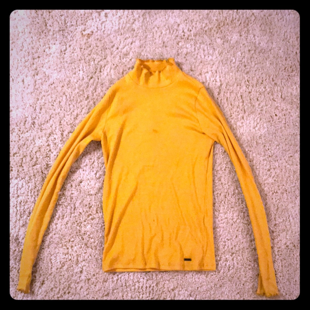 A yellow turtle neck